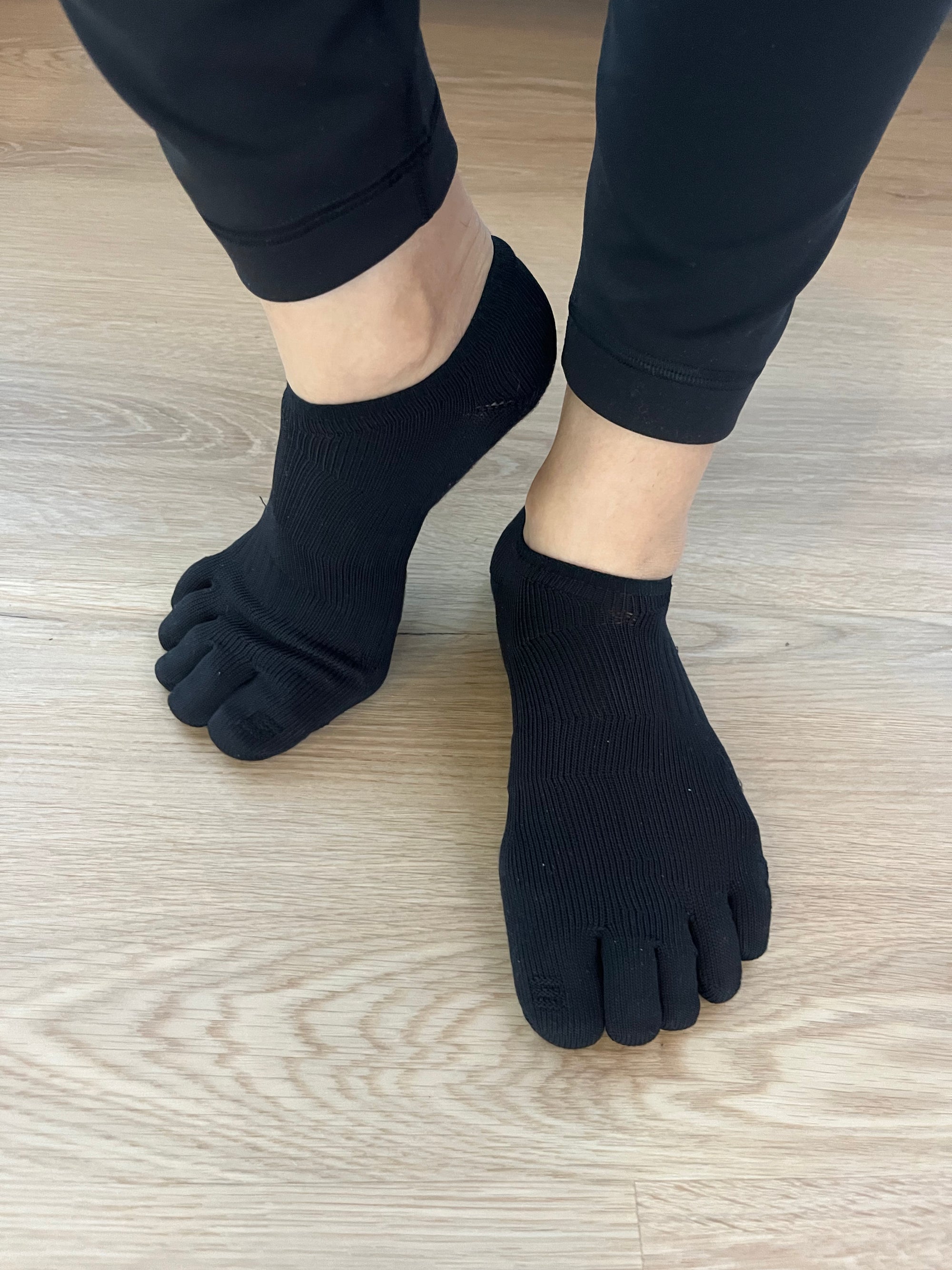 Black Compression Five-Toe Ankle Grip Socks showing individual toe separation